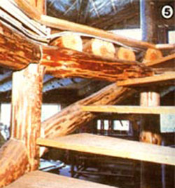 The circular stairways that connects the two elevations has its treads "let into" the supporting poles.
